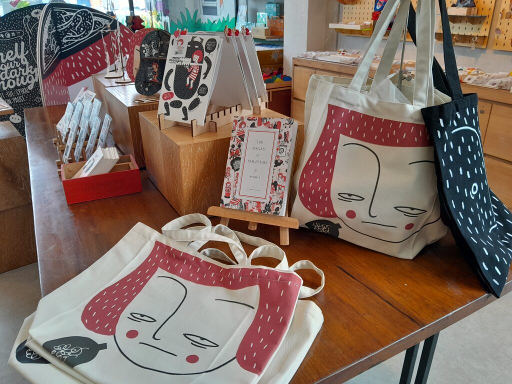Artist totebags at Sanguinella: Ink and Fire art exhibition